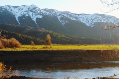 Scenic view of landscape and mountains against sky