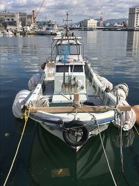 Boats moored at harbor