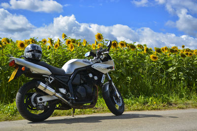 Motorcycle on road against sky