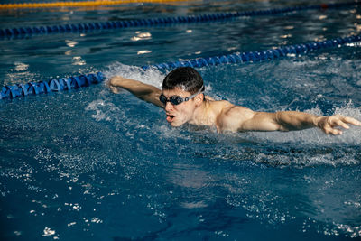 High angle view of man swimming in pool