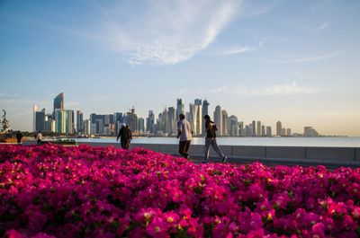 People jogging in front of cityscape 