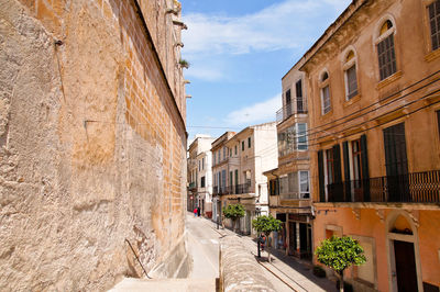 Narrow street amidst buildings in town