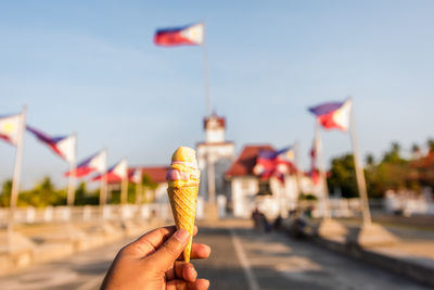 Hand holding ice cream cone