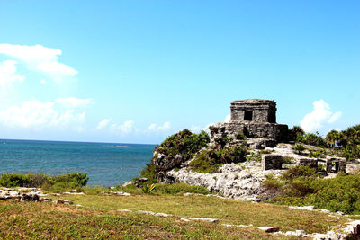 Scenic view of sea against cloudy sky