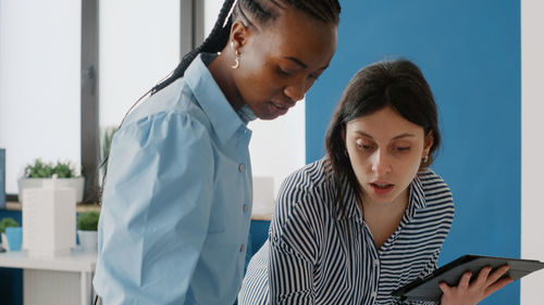 Side view of young man working at clinic