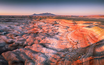 Moonscape landscape in utah. red rocks illuminated by sunrise.