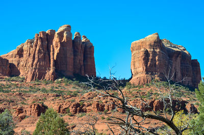 View of rock formation against clear blue sky