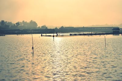 Scenic view of lake against sky during sunset