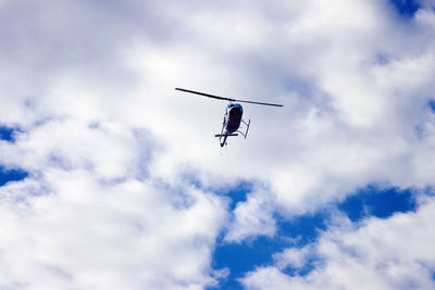 Low angle view of airplane flying in sky