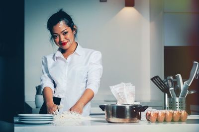 Portrait of woman preparing food