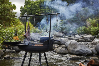 Open wood fired barbecue near stream