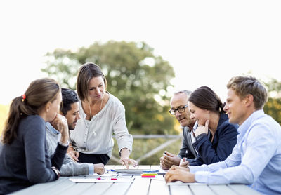 Group of business people working on patio