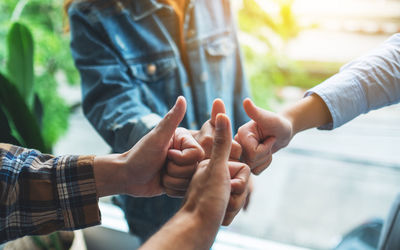 Cropped image of couple holding hands