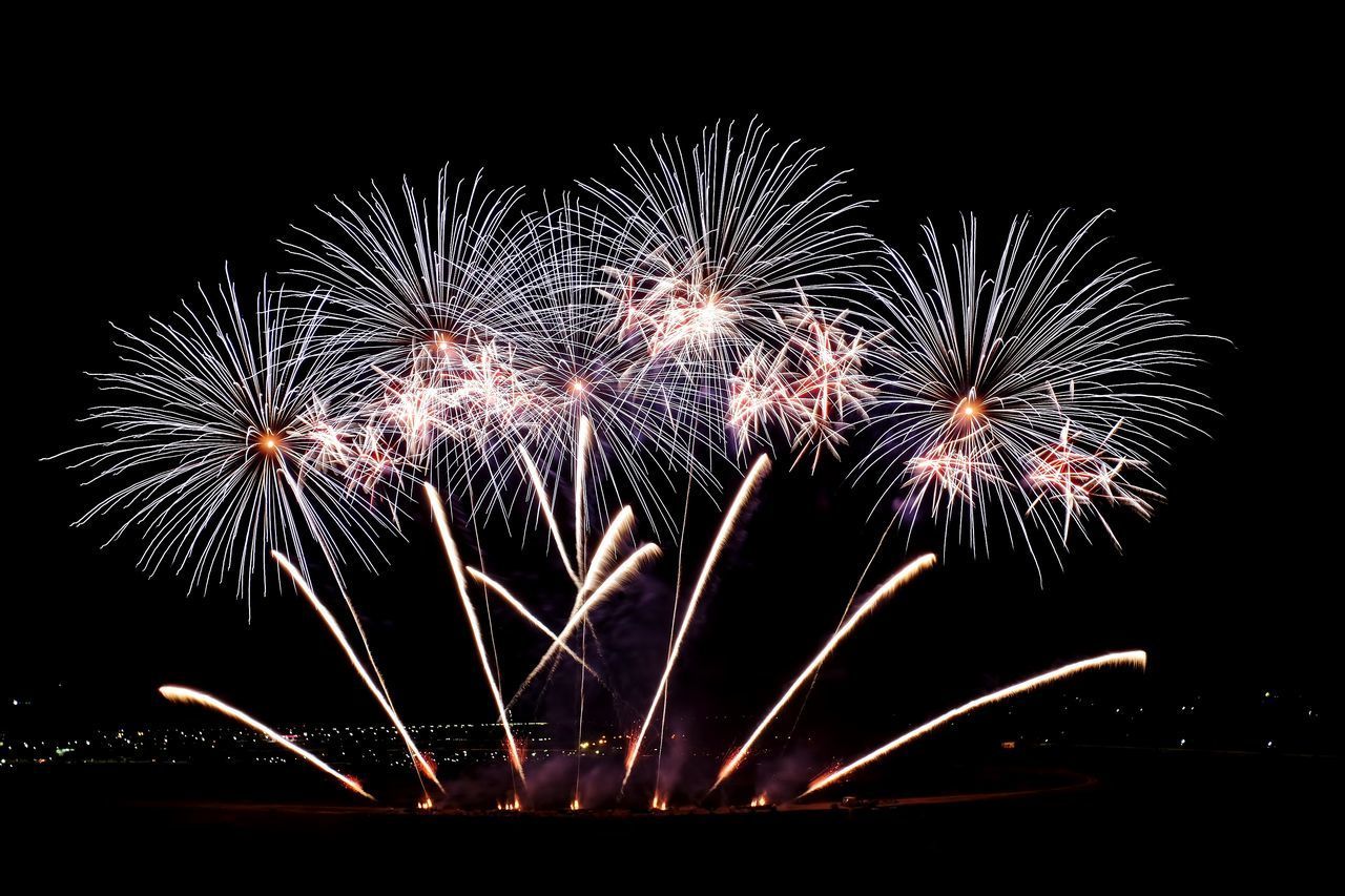 LOW ANGLE VIEW OF FIREWORK DISPLAY AGAINST SKY