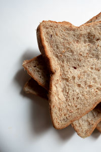 Close-up of bread on white background