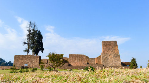 Old ruin rabdentse ruins, kingdom of sikkim, pelling, a destroyed capital city on field against sky