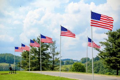 Low angle view of american flag against sky