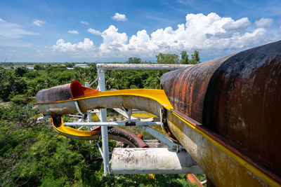 Abandoned truck on field against sky