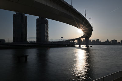 Bridge over river at rainbow bridge in tokyo