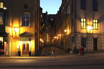 People walking on road at night