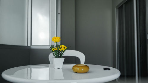 Flower vase on table at home