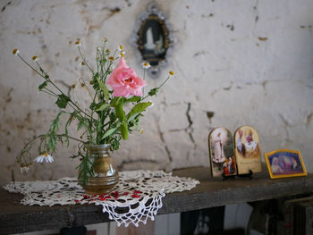 Close-up of roses in vase on table