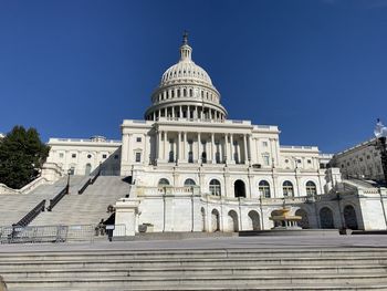 Low angle view of building against blue sky