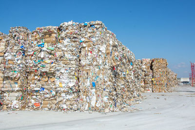 Stack of garbage against blue sky