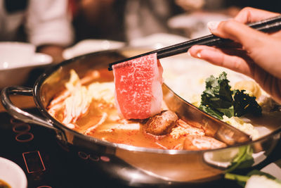 Close-up of person preparing food