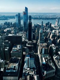 High angle view of modern buildings in city against sky