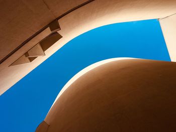 Low angle view of building against clear blue sky