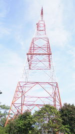 Low angle view of communications tower against sky