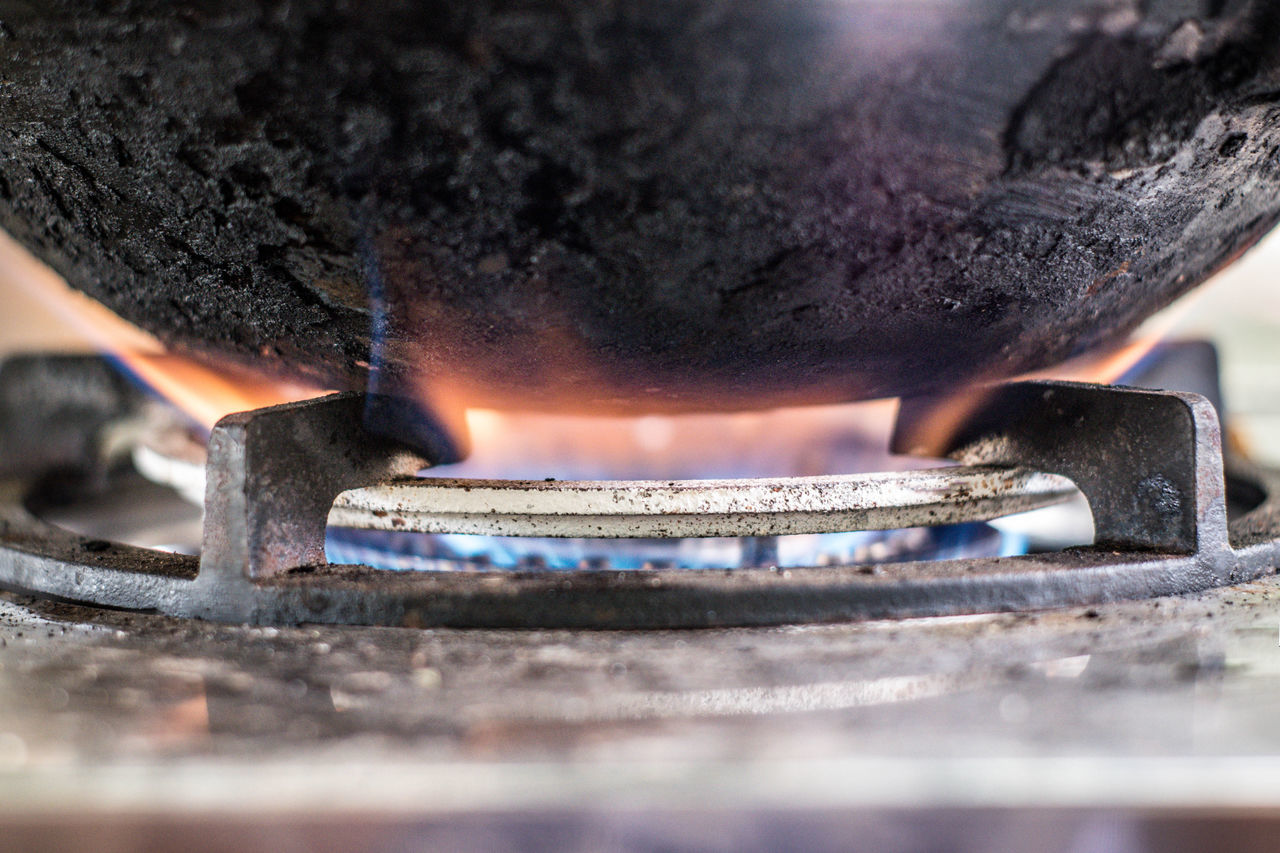 CLOSE-UP OF FIRE BURNING IN METAL