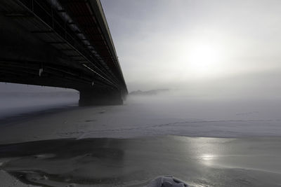 Bridge over sea against sky