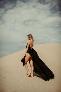 Woman standing at desert