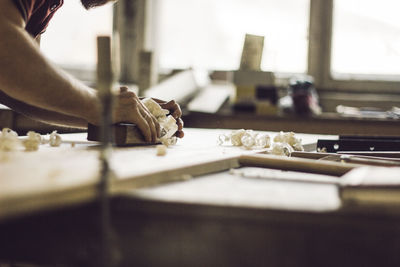 Close-up of man working on table