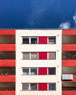 Low angle view of red building against sky