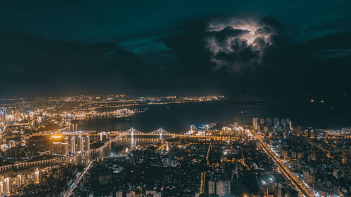 High angle view of illuminated buildings in city at night