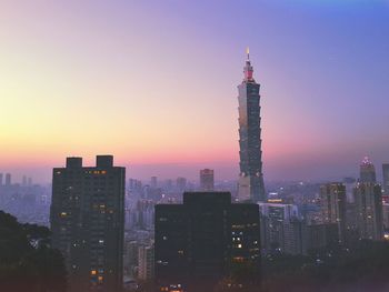 Cityscape with taipei 101 against orange sky during sunset