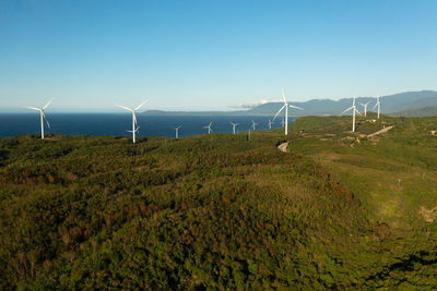 Group of windmills for renewable electric energy production. wind power station. philippines.