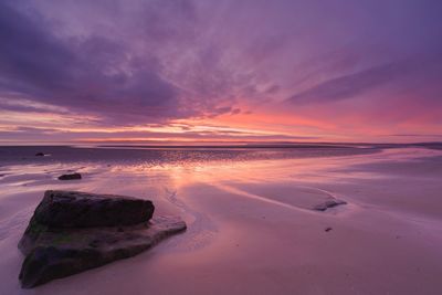 Scenic view of sea against sky at sunset