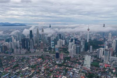 High angle view of modern buildings in city against sky