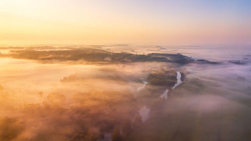 Summer nature landscape aerial panorama. morning fog over river, meadow forest. nature sunlight 