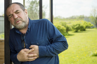 Portrait of man standing outdoors