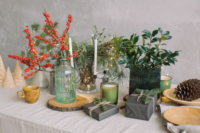 Christmas presents on decorated table at home