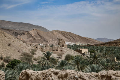 Panoramic view of building and mountains against sky