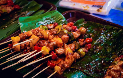 High angle view of meat on barbecue grill