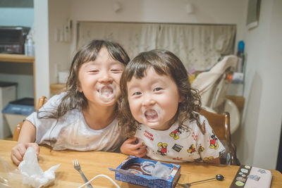 Portrait of siblings at home