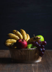 Close-up of apples in container on table