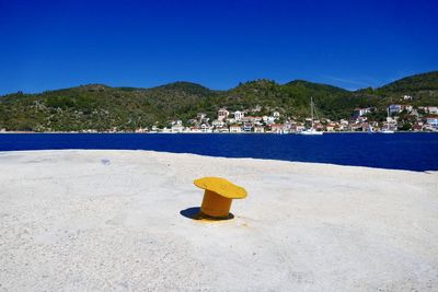 Scenic view of sea against clear blue sky